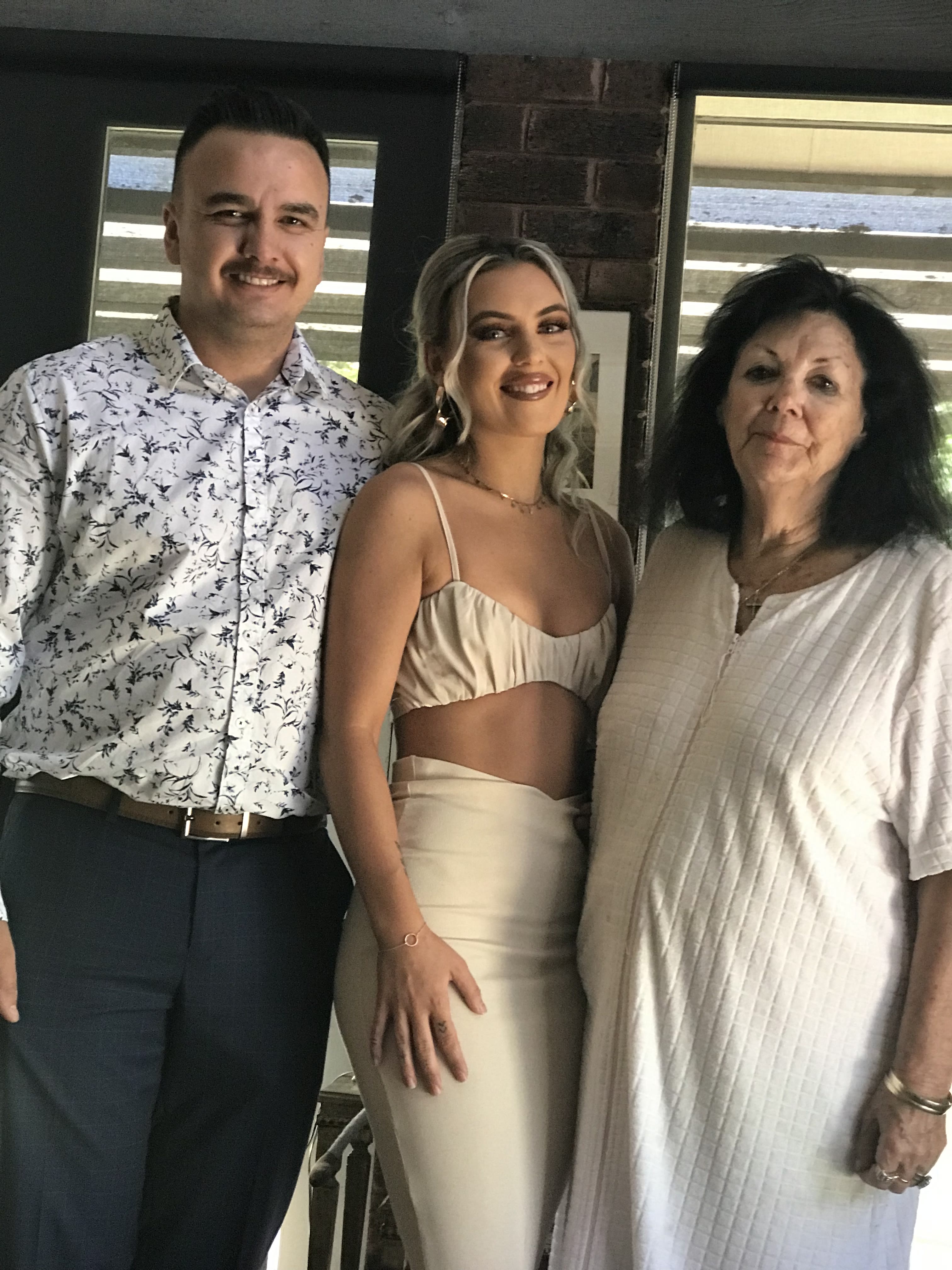 Jake, Miranda and Pam posed together indoors