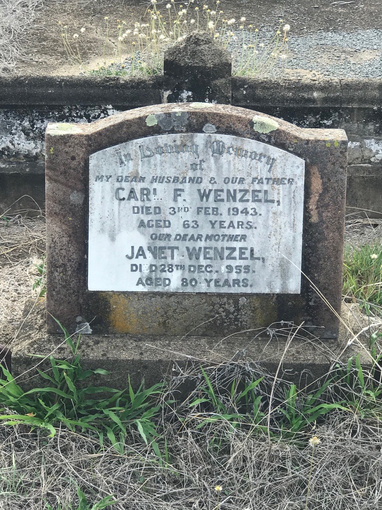 A headstone naming Carl F. Wenzel and Janet Wenzel