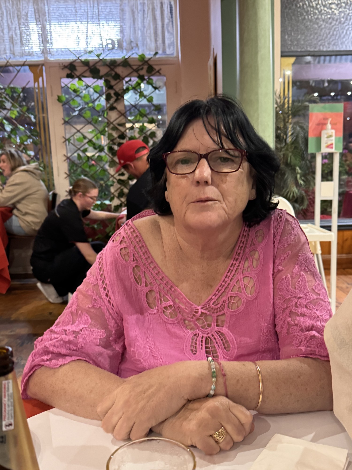 Julie at a restaurant table