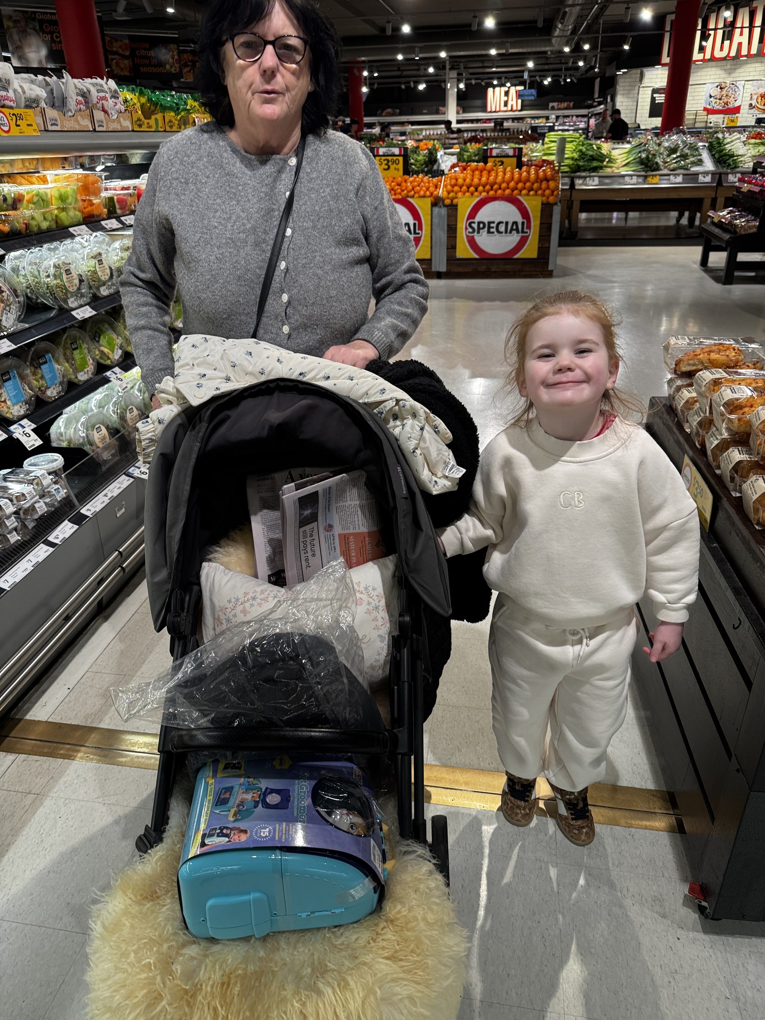 Julie and a child together in a supermarket