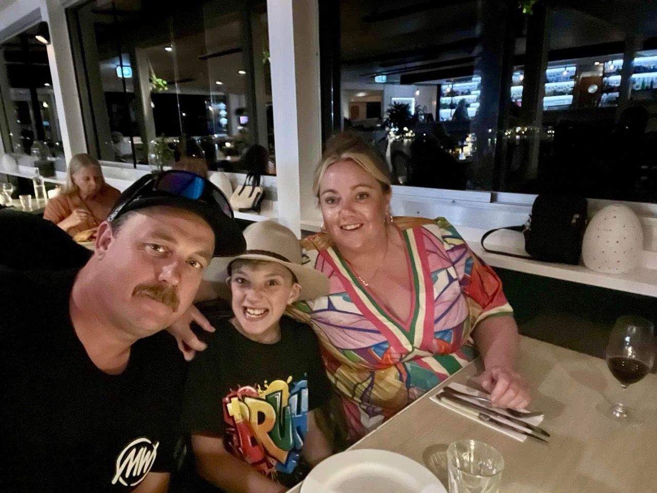 Lawrence with family at dinner