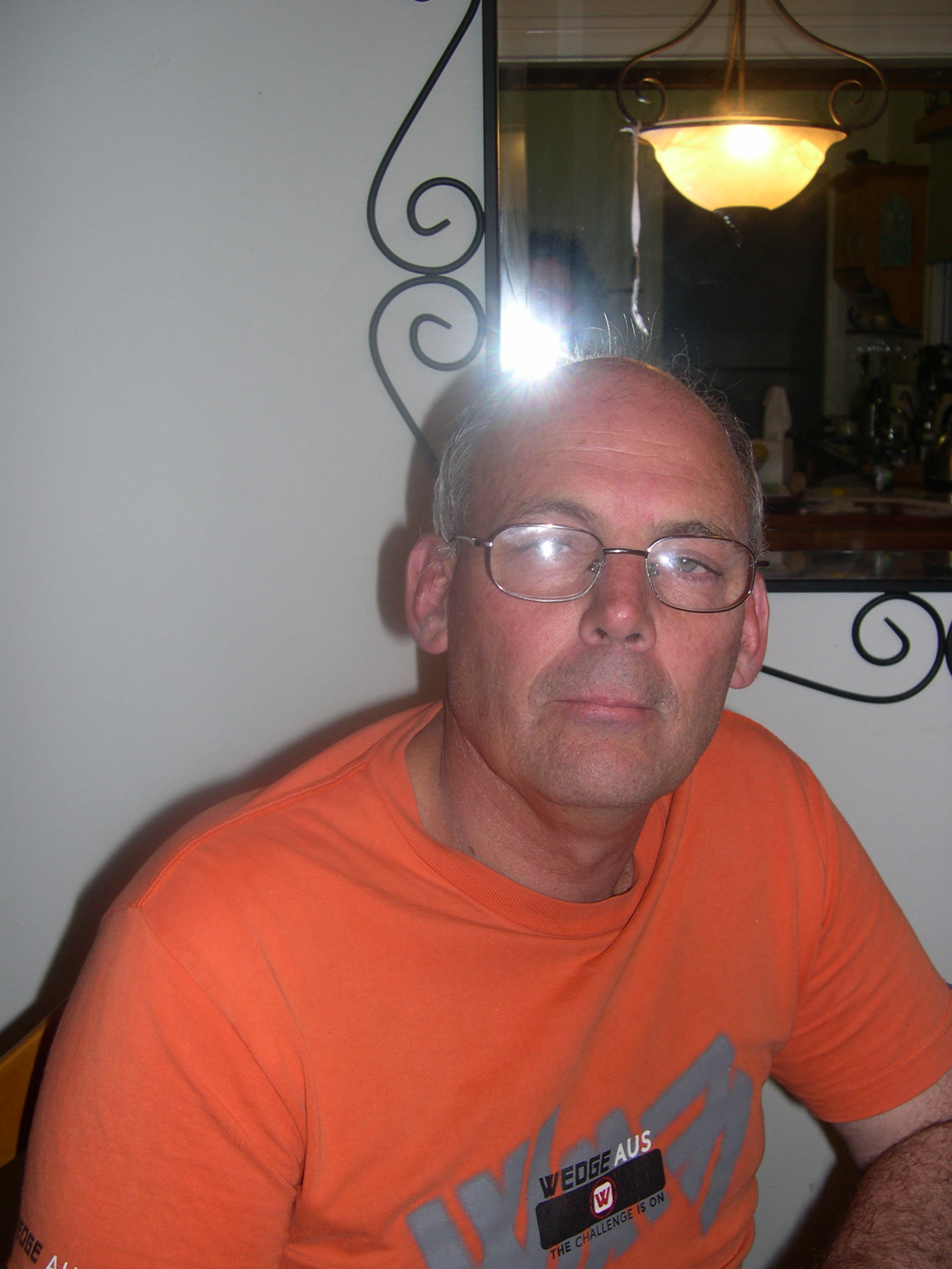 Close portrait of Martin in an orange shirt