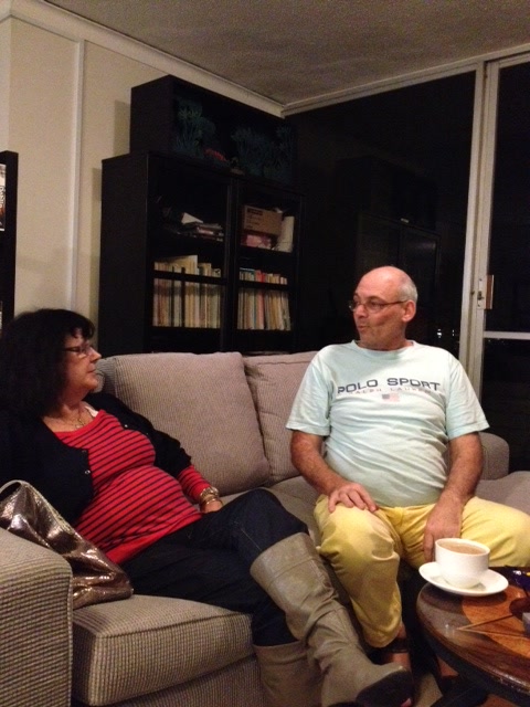 Martin and an unidentified companion talking on a sofa