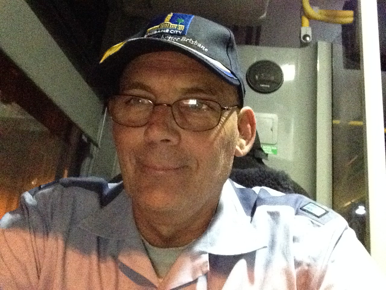 Close portrait of Martin in a cap and collared shirt