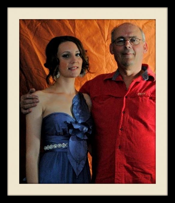 Martin in a red shirt beside Beatrix Fletcher in a blue formal dress