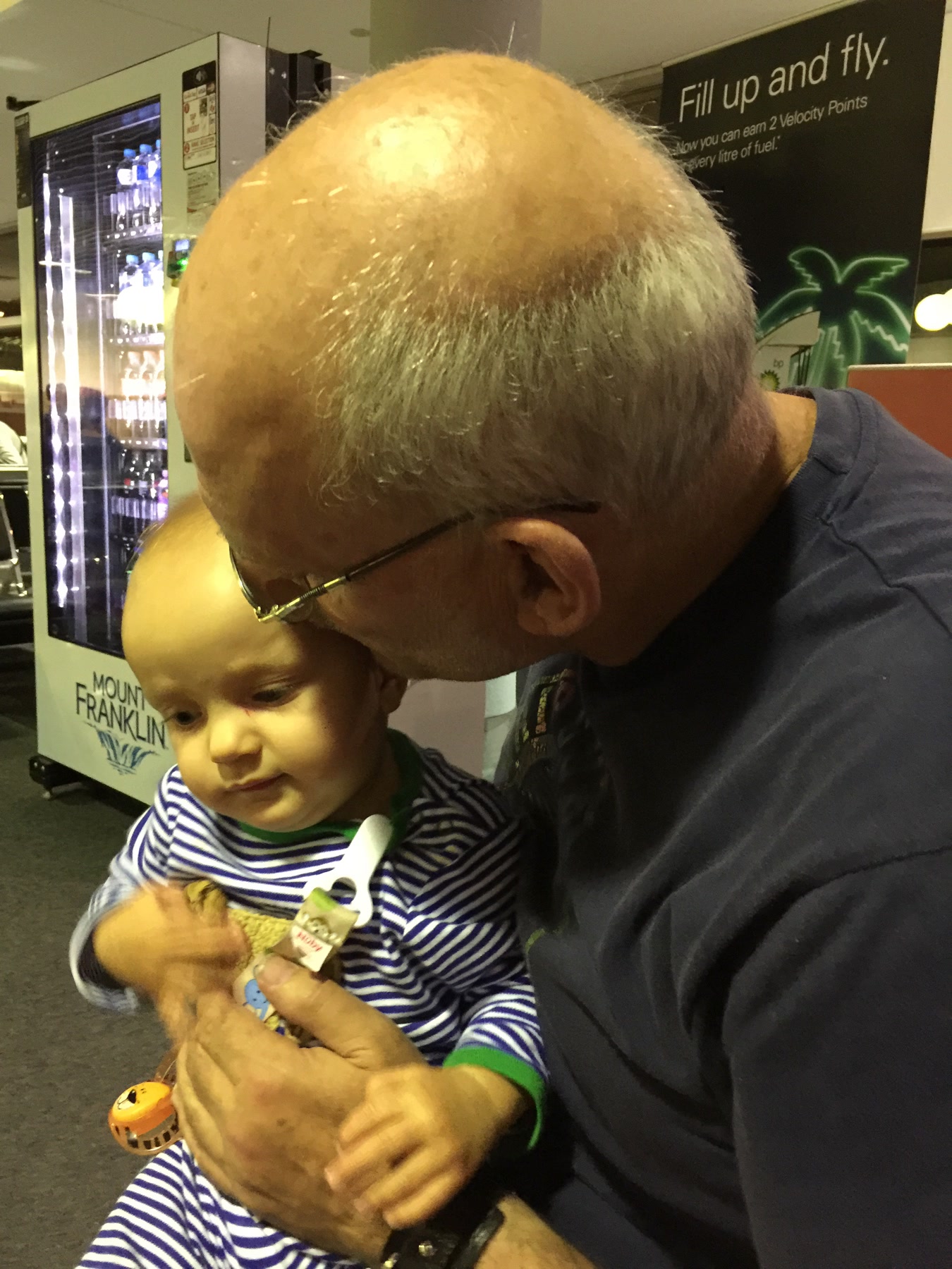 Martin kissing an infant on the forehead