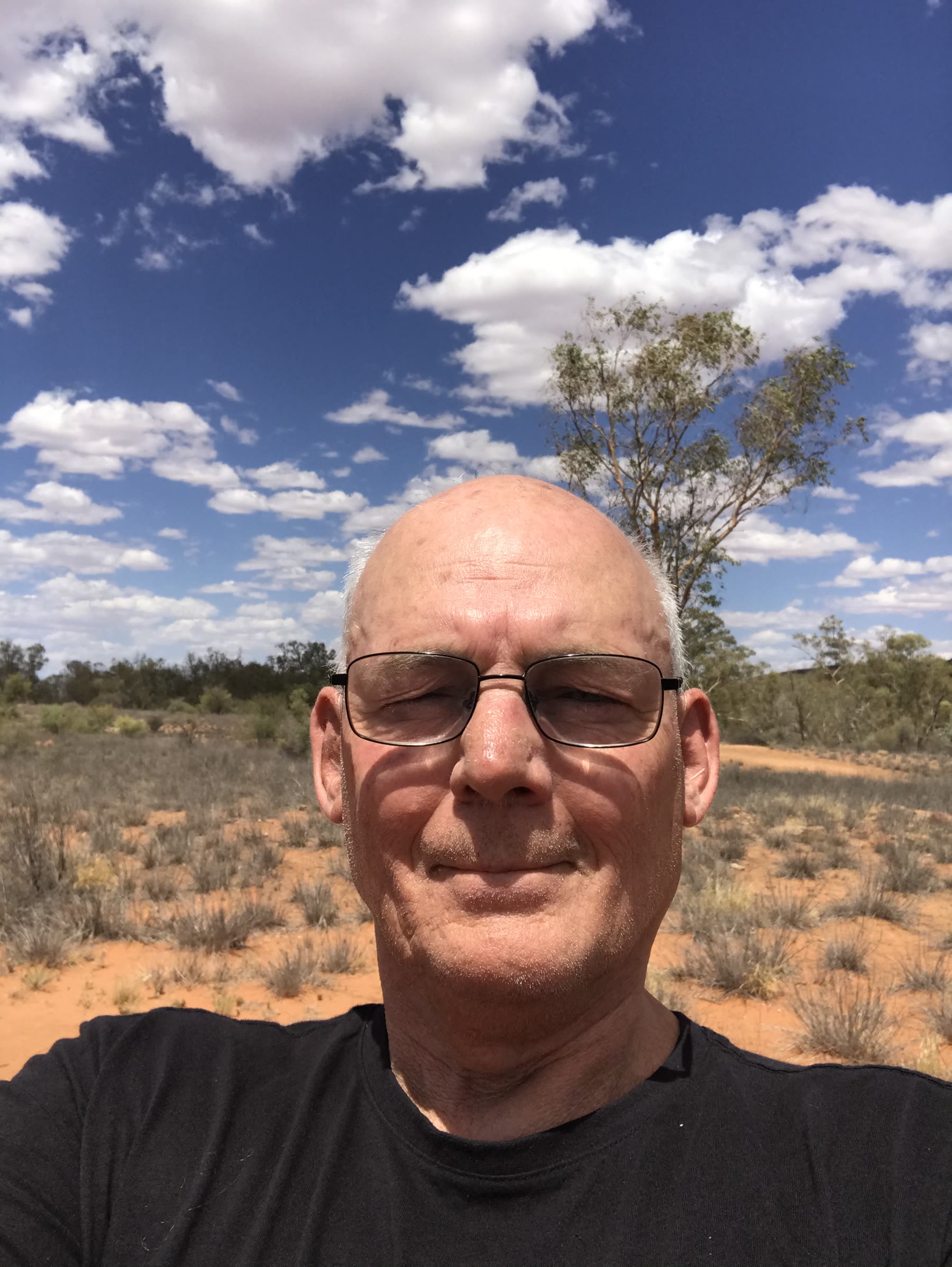 Clear portrait of Martin at Owen Springs Reserve under a bright sky