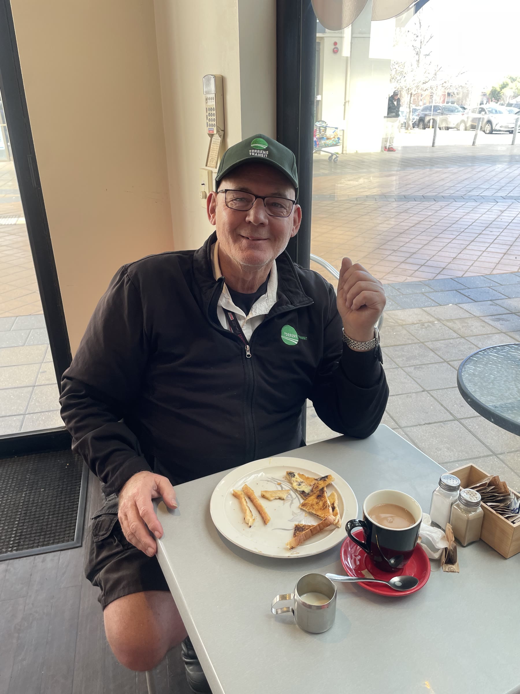 Martin seated at a table at Port Mall Shopping Centre