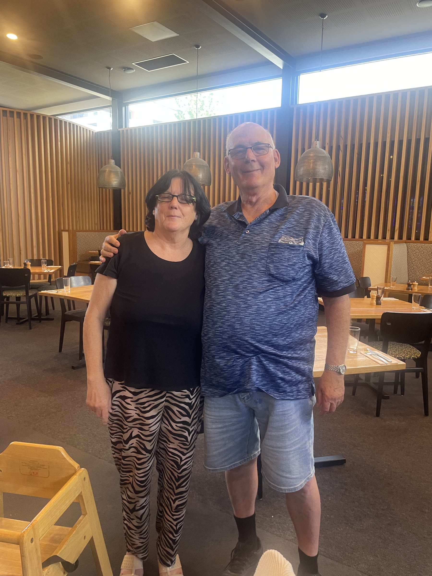 Martin standing beside an unlabelled companion in a Melbourne restaurant